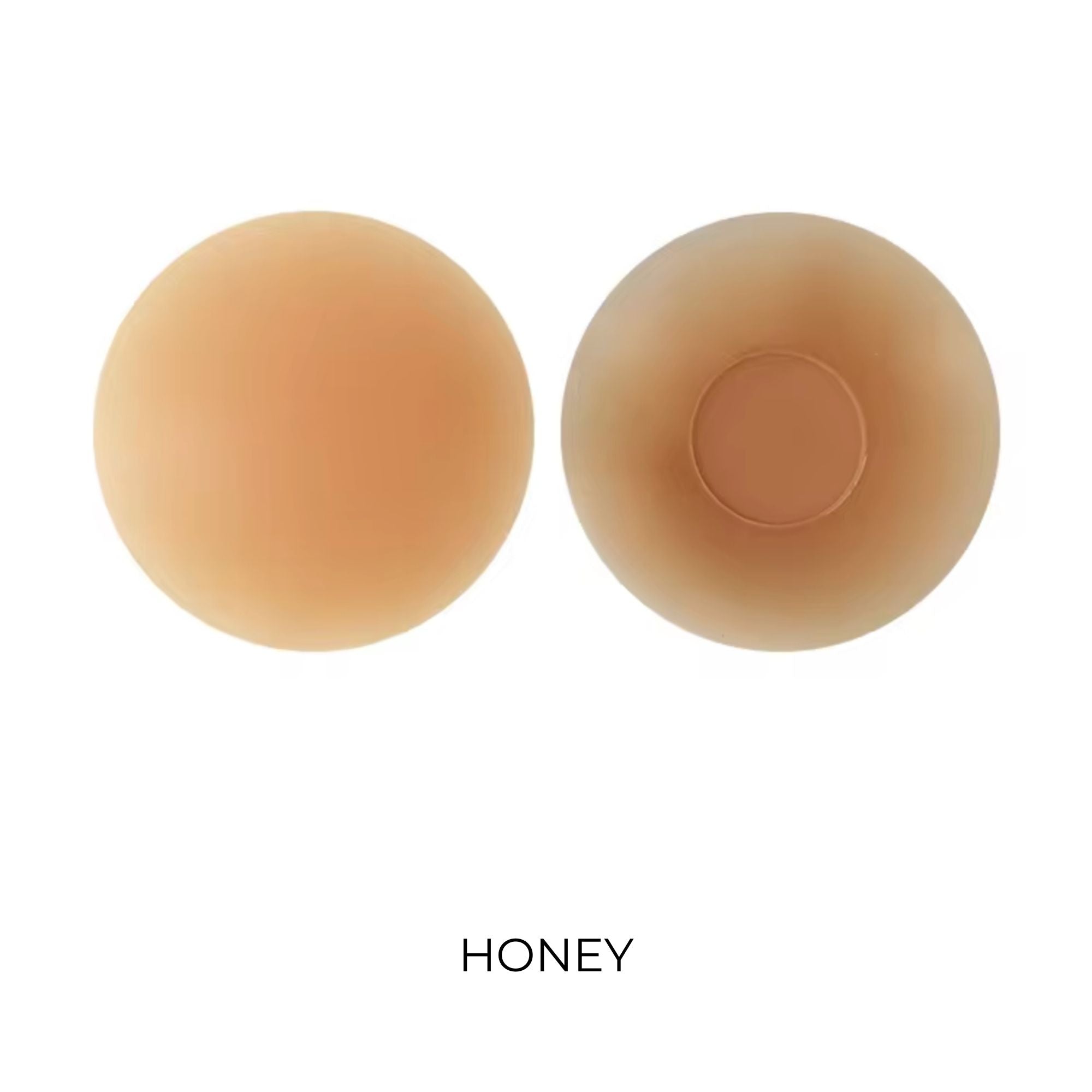 Two beige-colored nipple covers labeled 'Honey' on a white background
