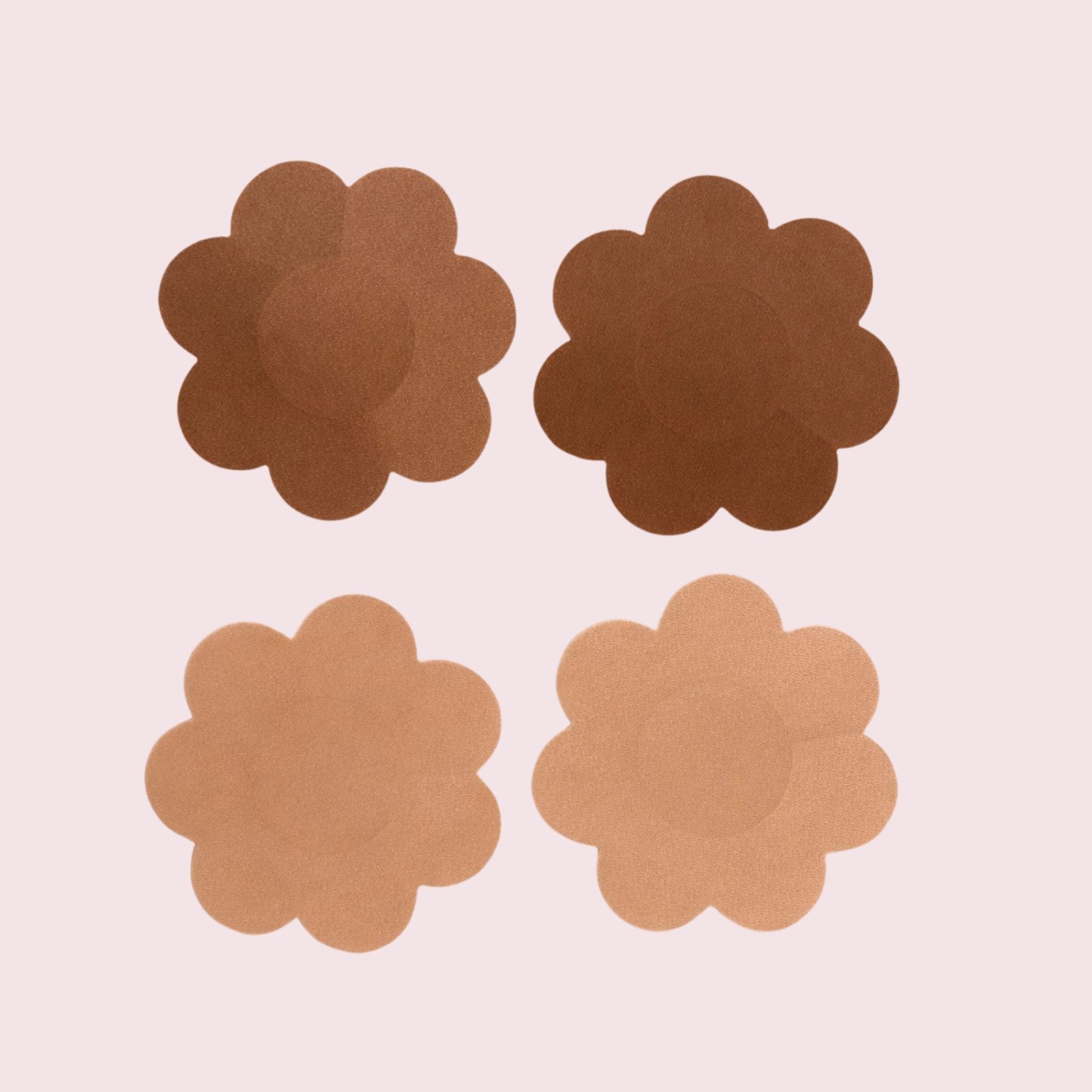 Four brown and nude petal nipple pasties on a light pink background