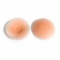Reusable silicone nipple covers on a white background
