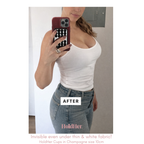 Person taking 'after' mirror selfie wearing seamless nipple covers under her white top